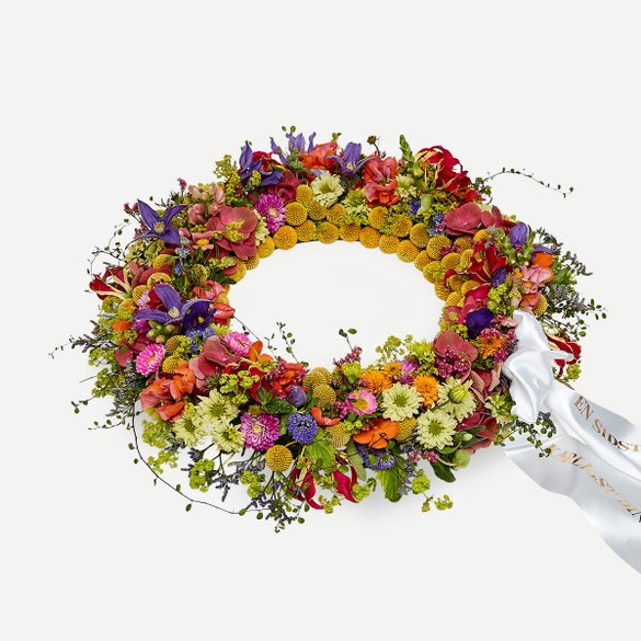 Rundpyntet krans med bånd - Et farverigt farvel